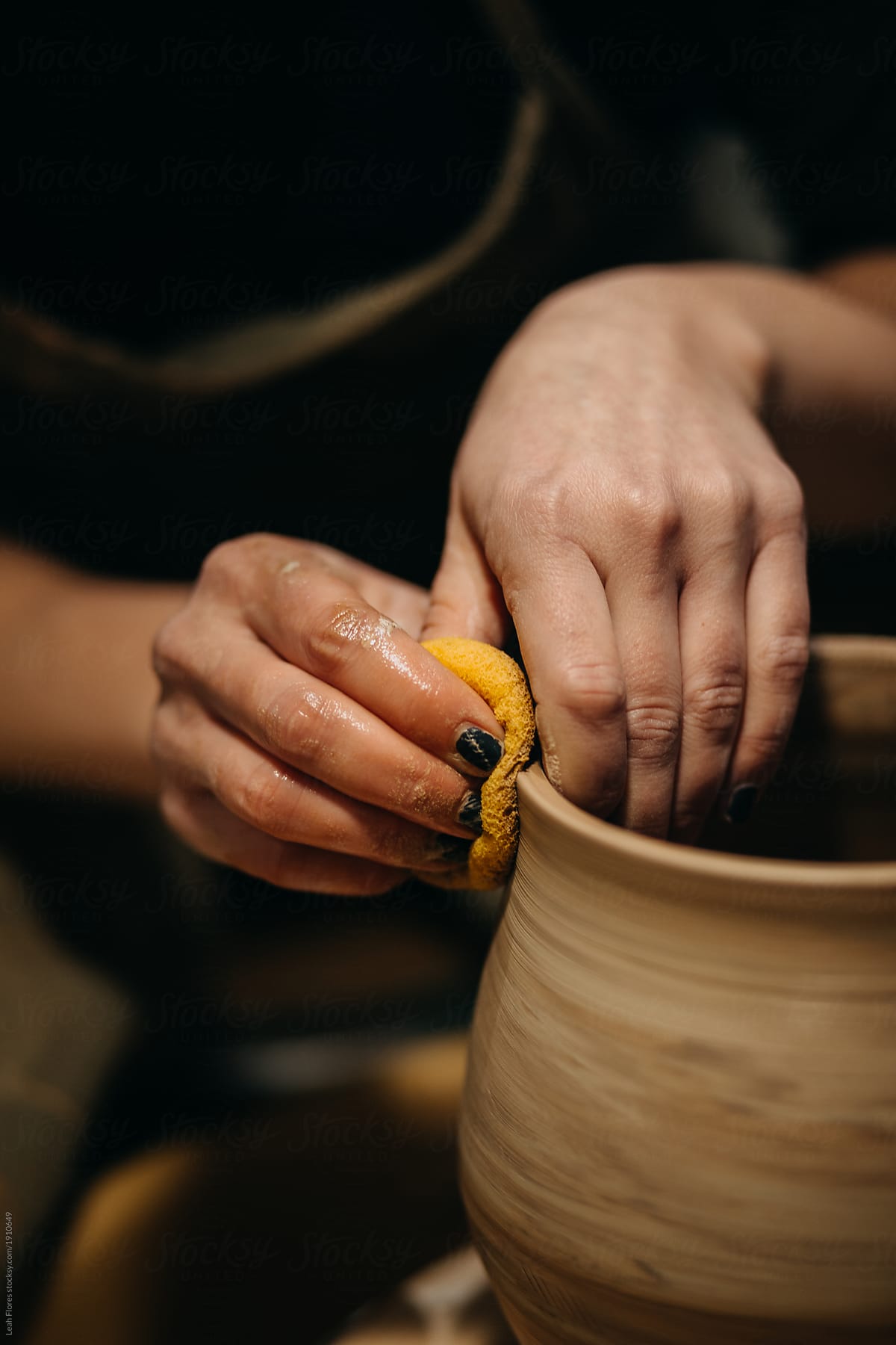 Potter Making Pots in Studio