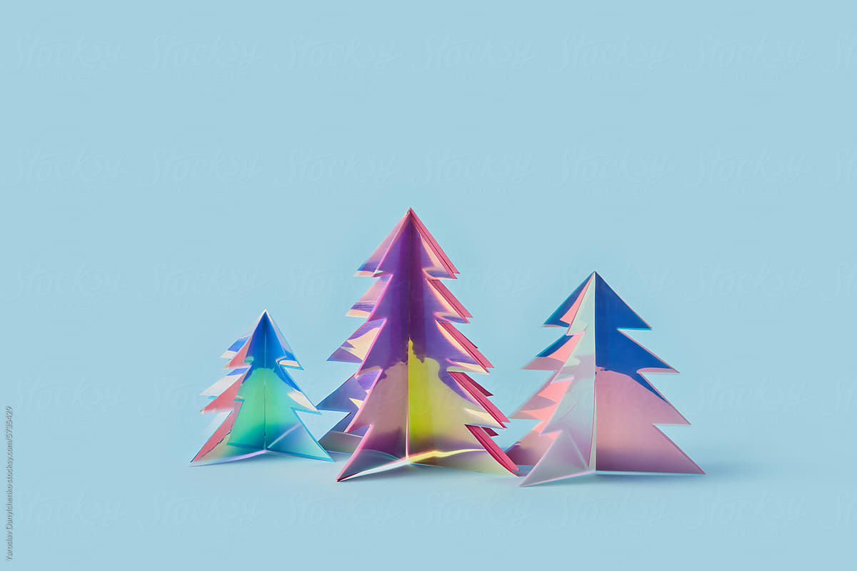 Trio of decorative Christmas trees handcrafted from iridescent foil