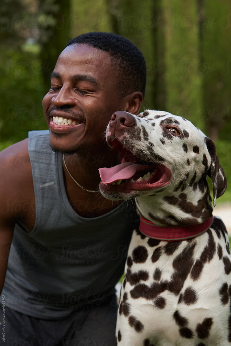 Close up of a happy doggy  and young men