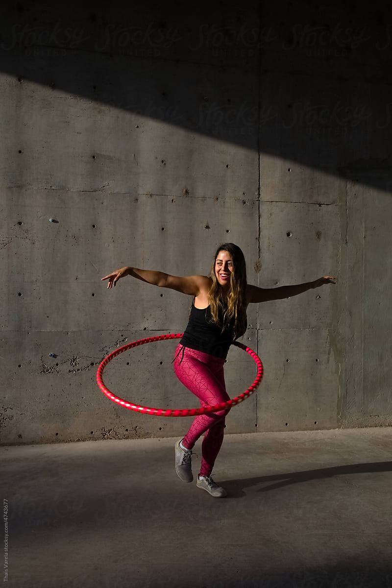 woman does her hula hoop workout
