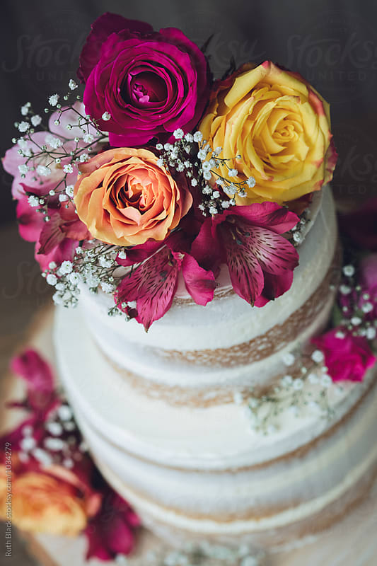 Wedding cake decorated with fresh flowers