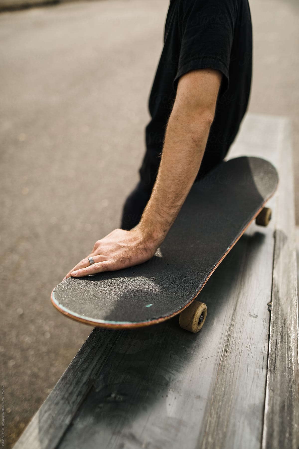 Man sitting on skateboard