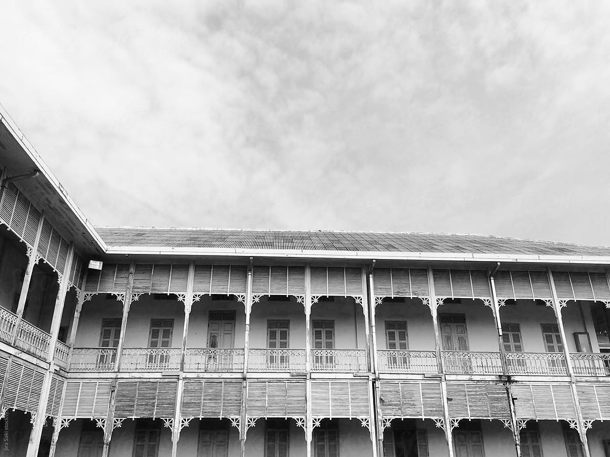 old colonial style wooden building,monochrome