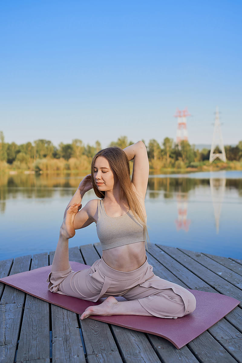 spring morning beautiful yoga woman with natural body doing asana outdoor fitness
