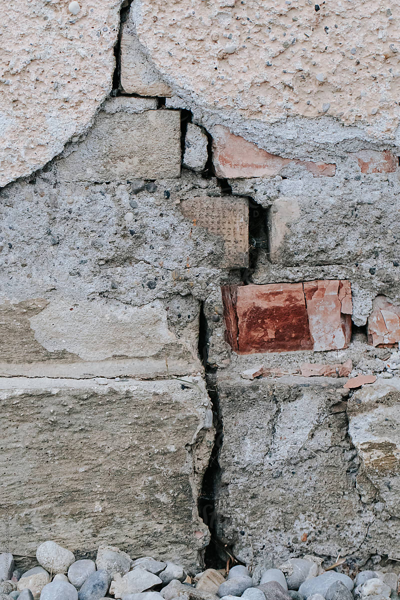 Badly cracked brick exterior building wall