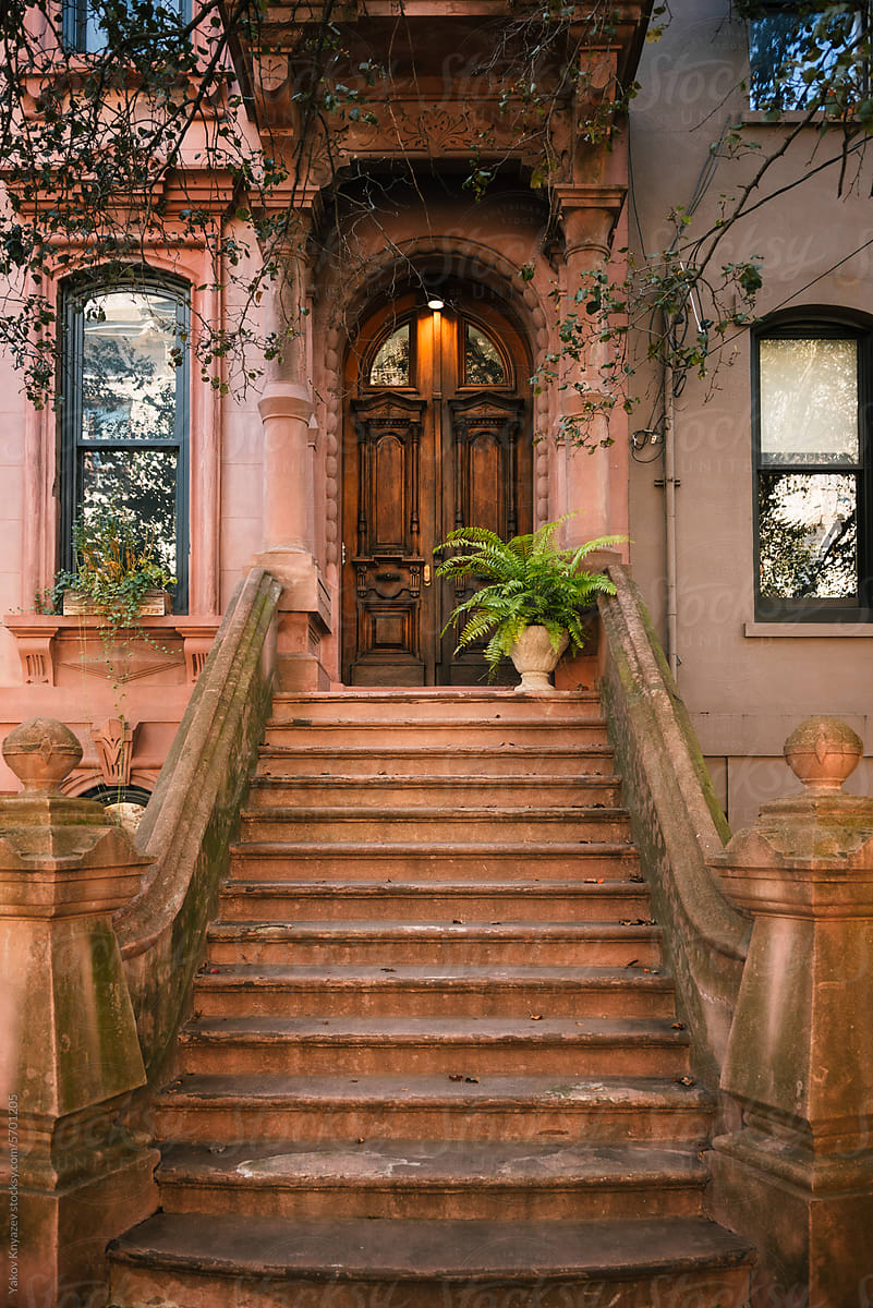 American brownstone house with a high stoop