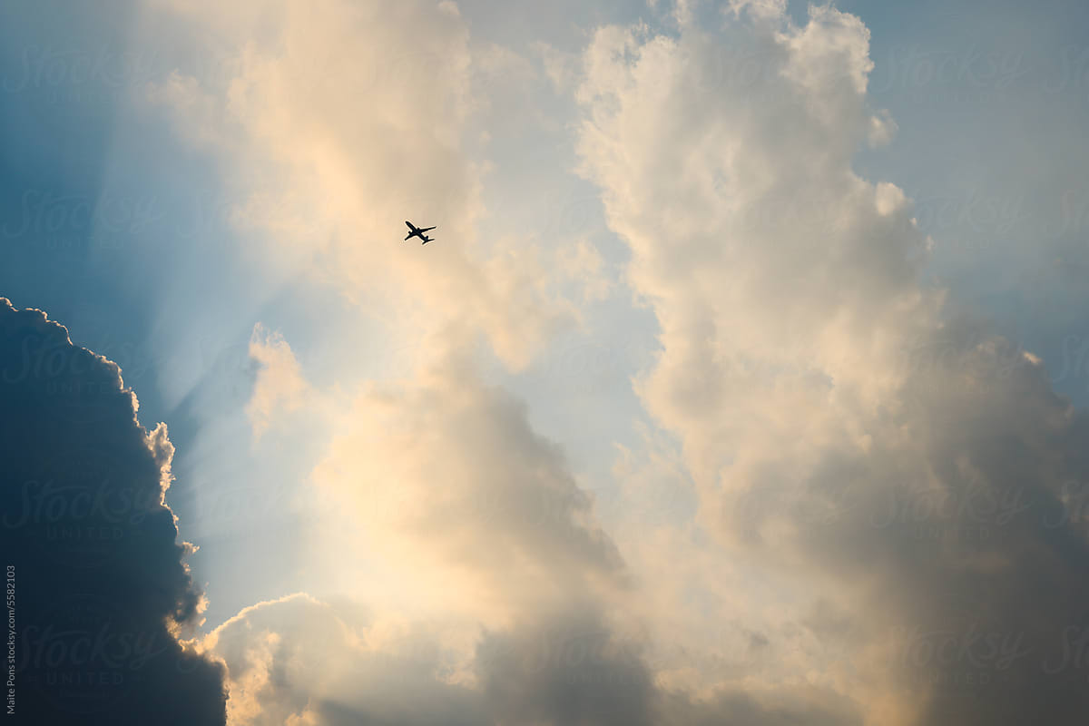 Airplane in Cloudy Sky