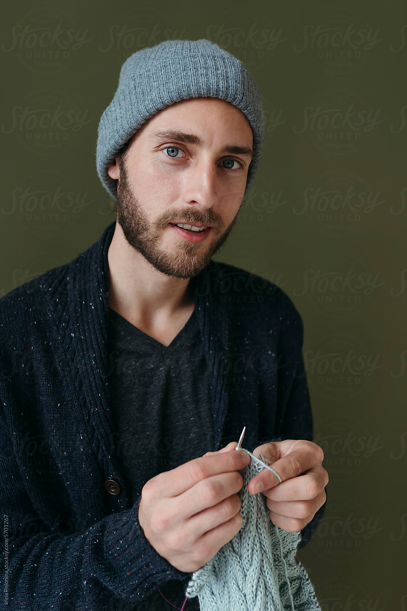Portrait of knitting modern smiling man.