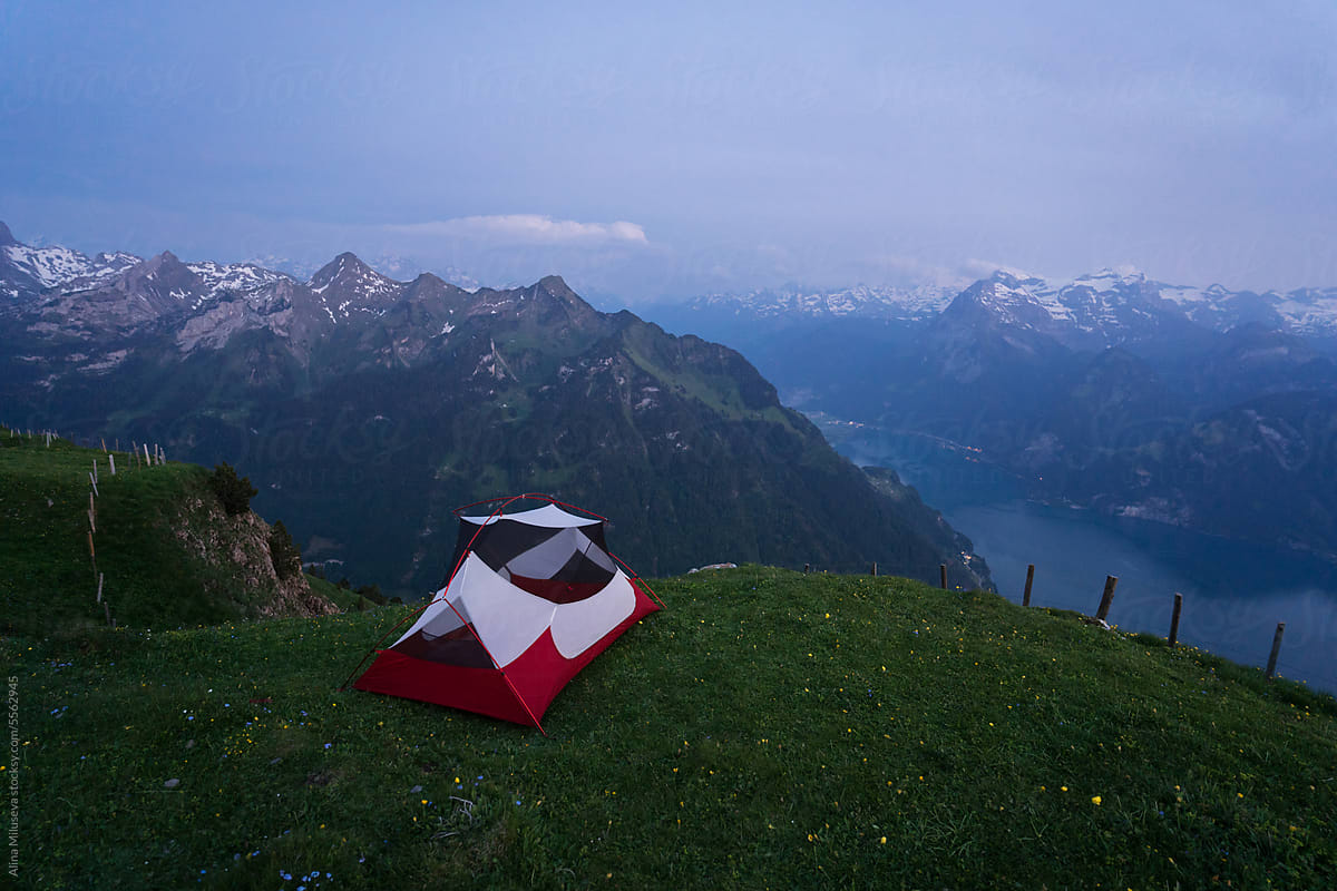 Camping Tent With Mountain Range View At Dusk