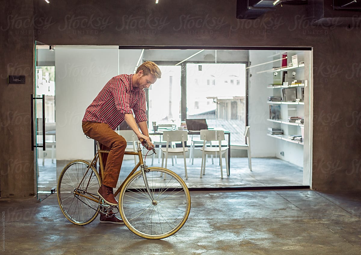 Man Riding a Bicycle Indoors