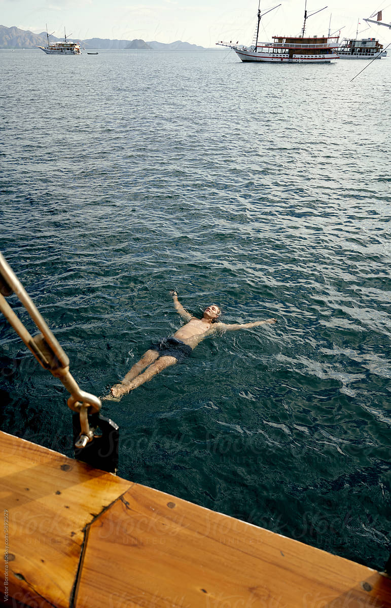 Man relaxed Swimming in open waters