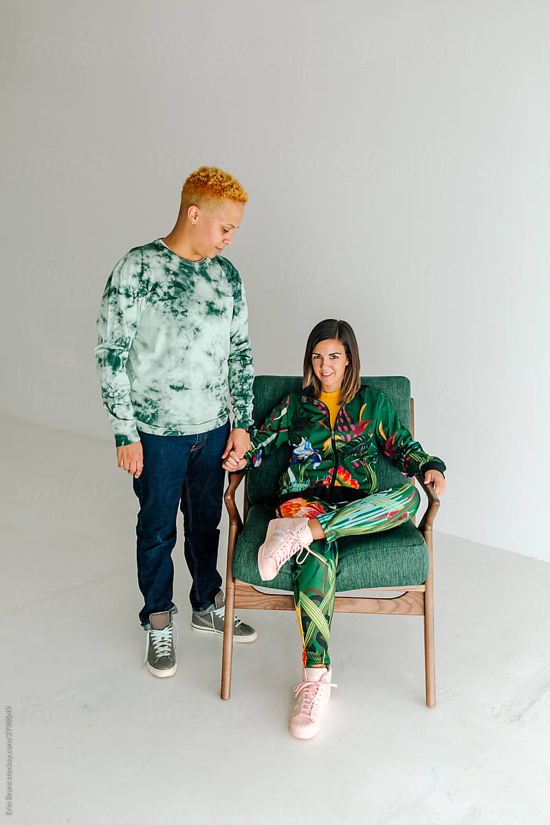 Gay woman and partner in green chair
