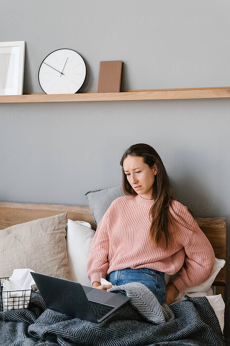 Woman Sitting At Desk With Laptop by Stocksy Contributor Alina