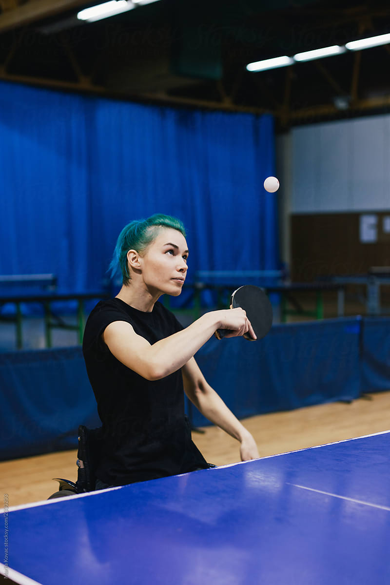 Woman in wheelchair playing table tennis