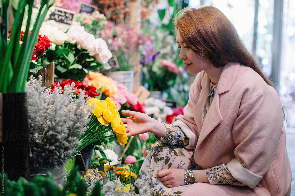 Florist Working In Her Flower Shop. by Stocksy Contributor
