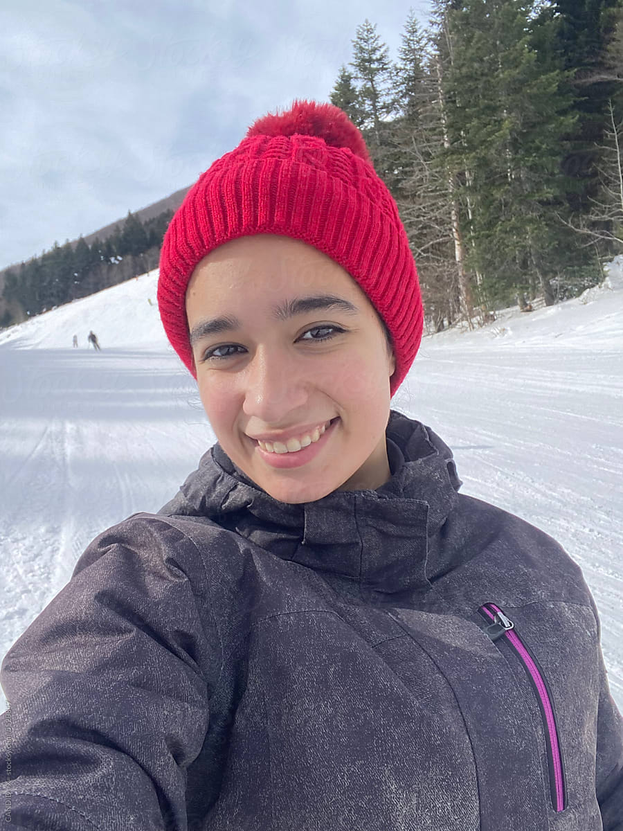 Cute Selfie of a Girl on a Snowy Mountain
