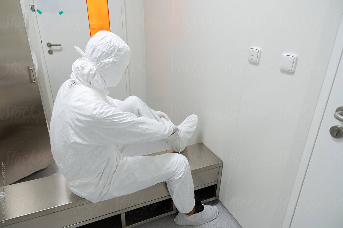 Researcher Putting Safety Clothing