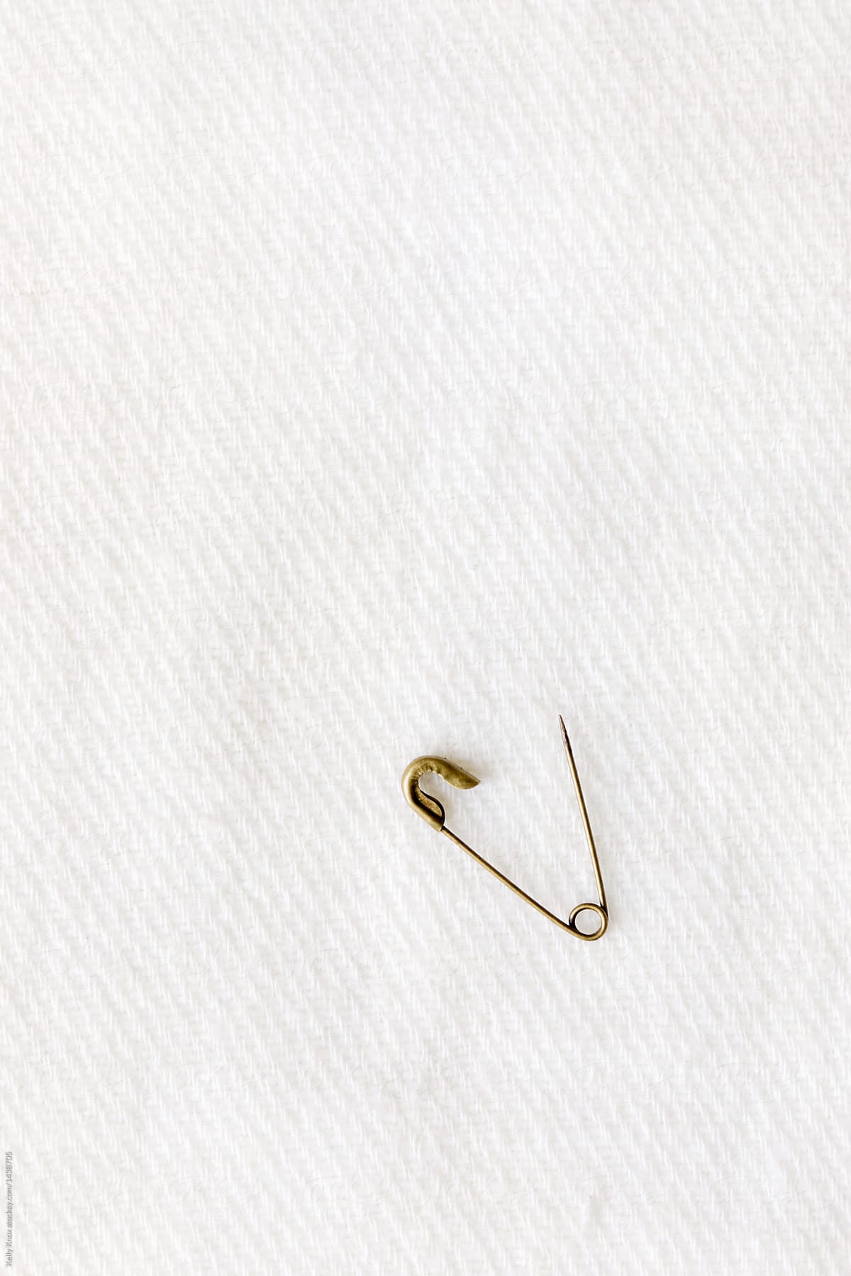 small safety pin unfastened