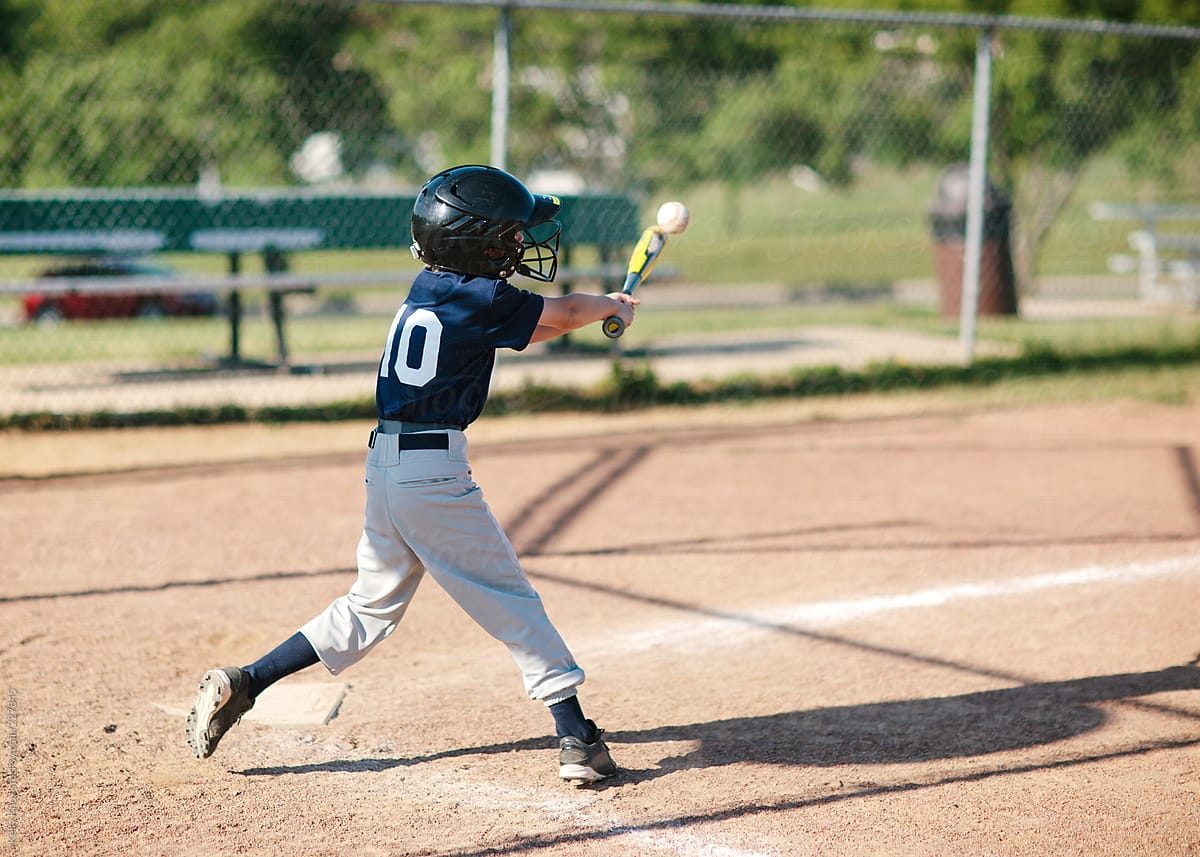 baseball player hitting the ball