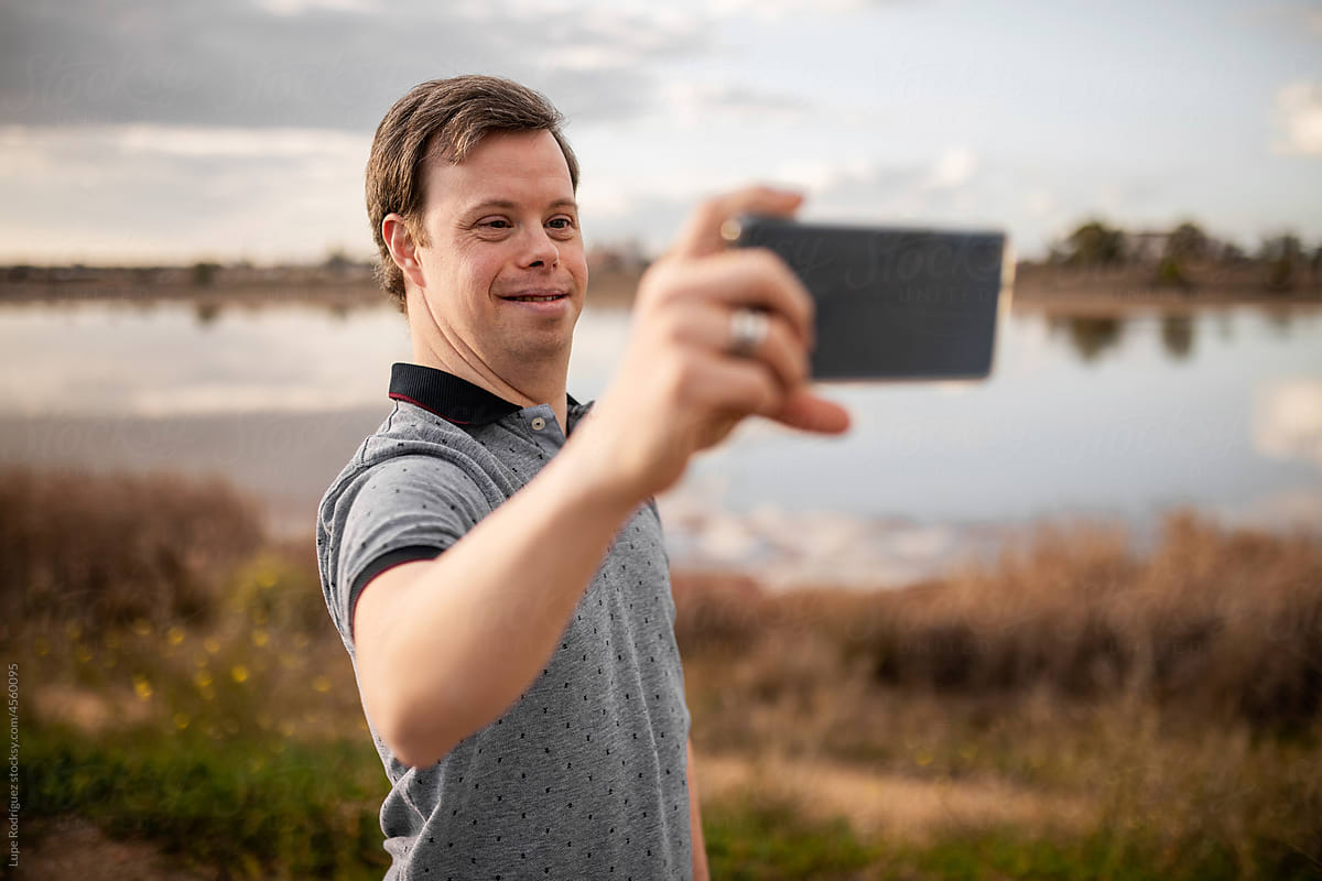Man with down syndrome with mobile phone