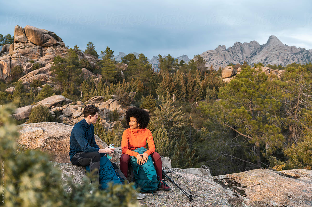 Diverse couple hiking and backpacking, outdoor lifestyle, diversity