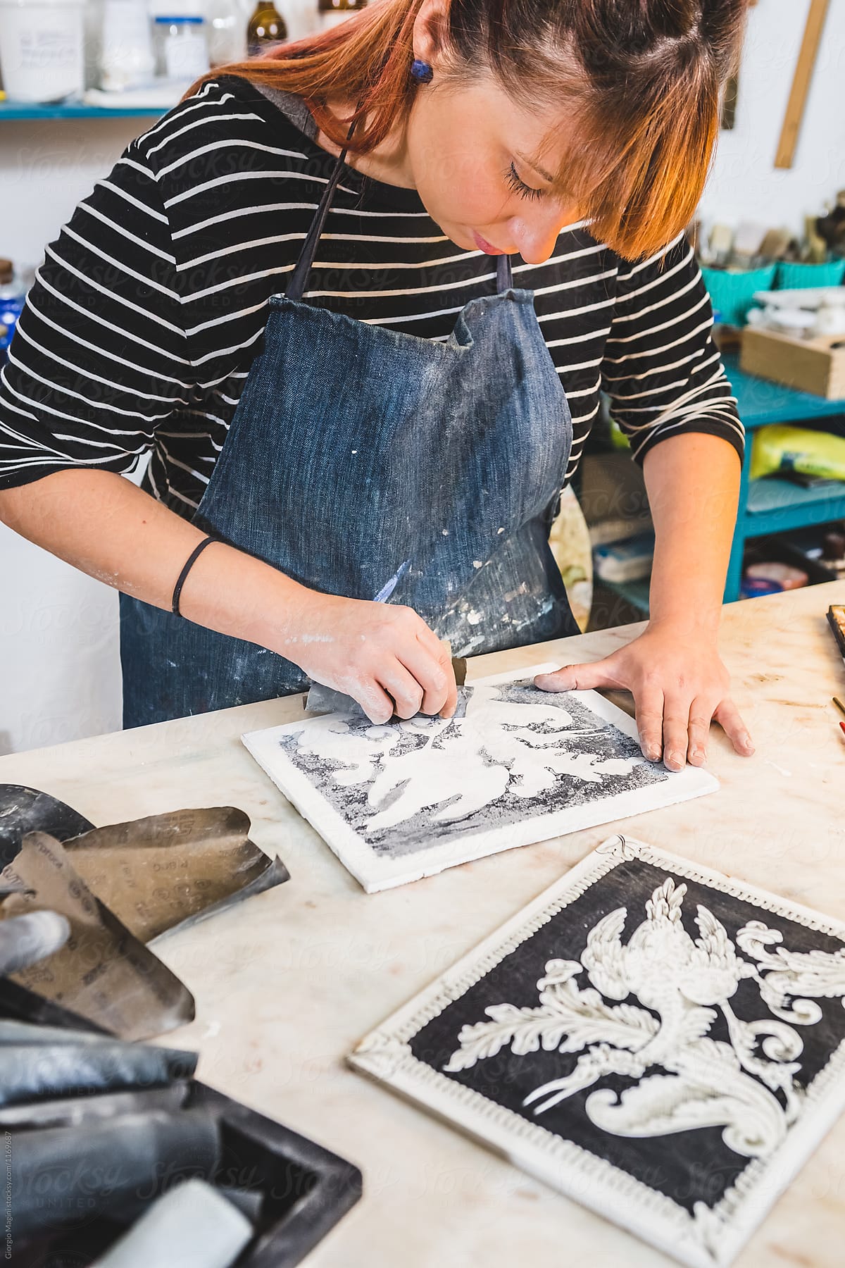 Artisan Woman Using Sandpaper on a Scagliola Artwork