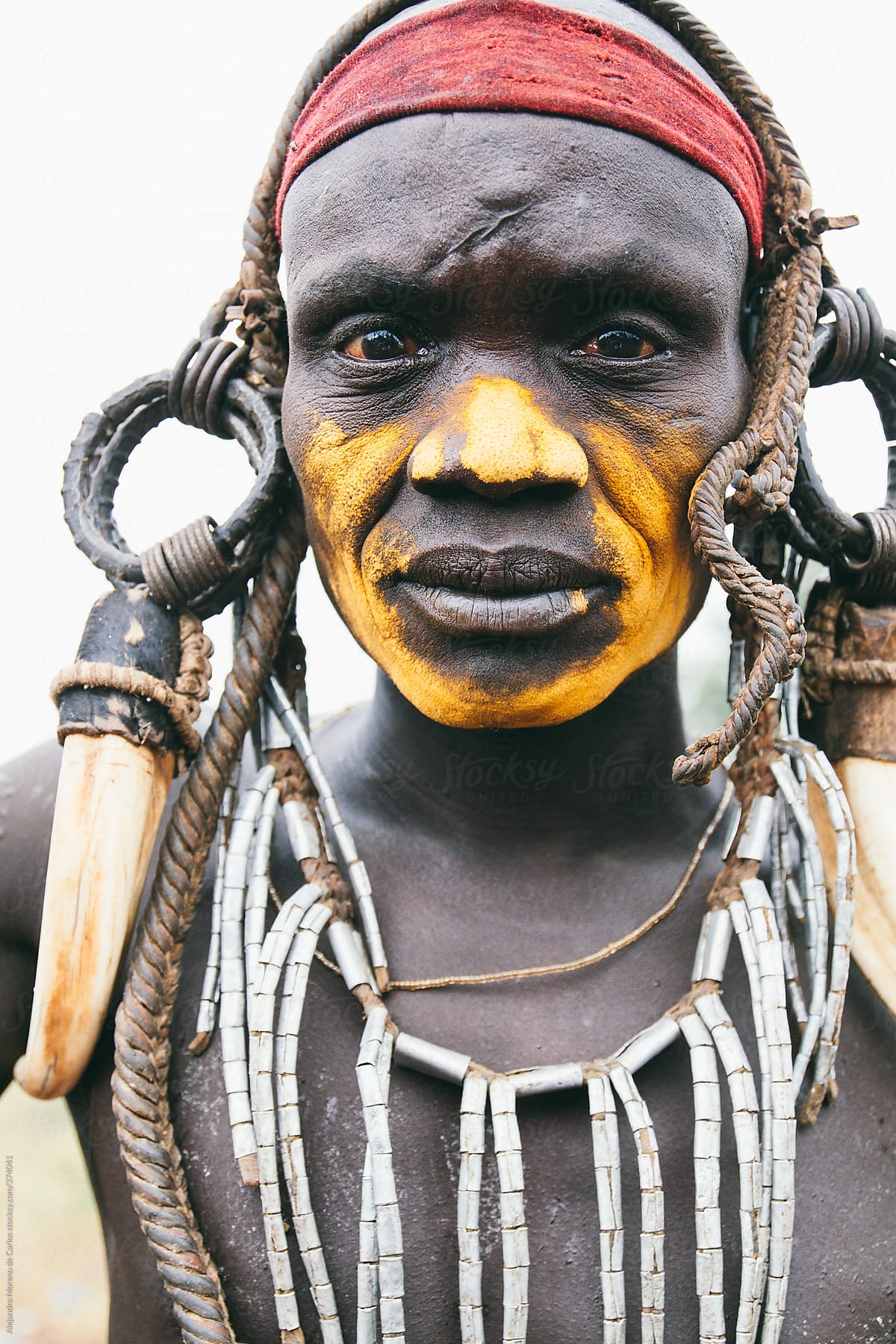 Mursi tribe man portrait with traditional clothes. Mago National park, Ethiopia, Africa