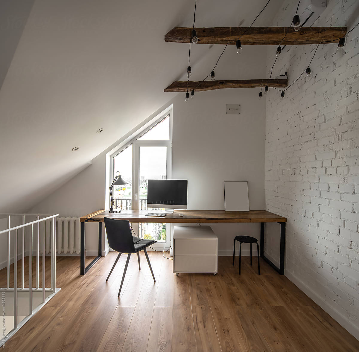 Attic level in modern flat with brick wall
