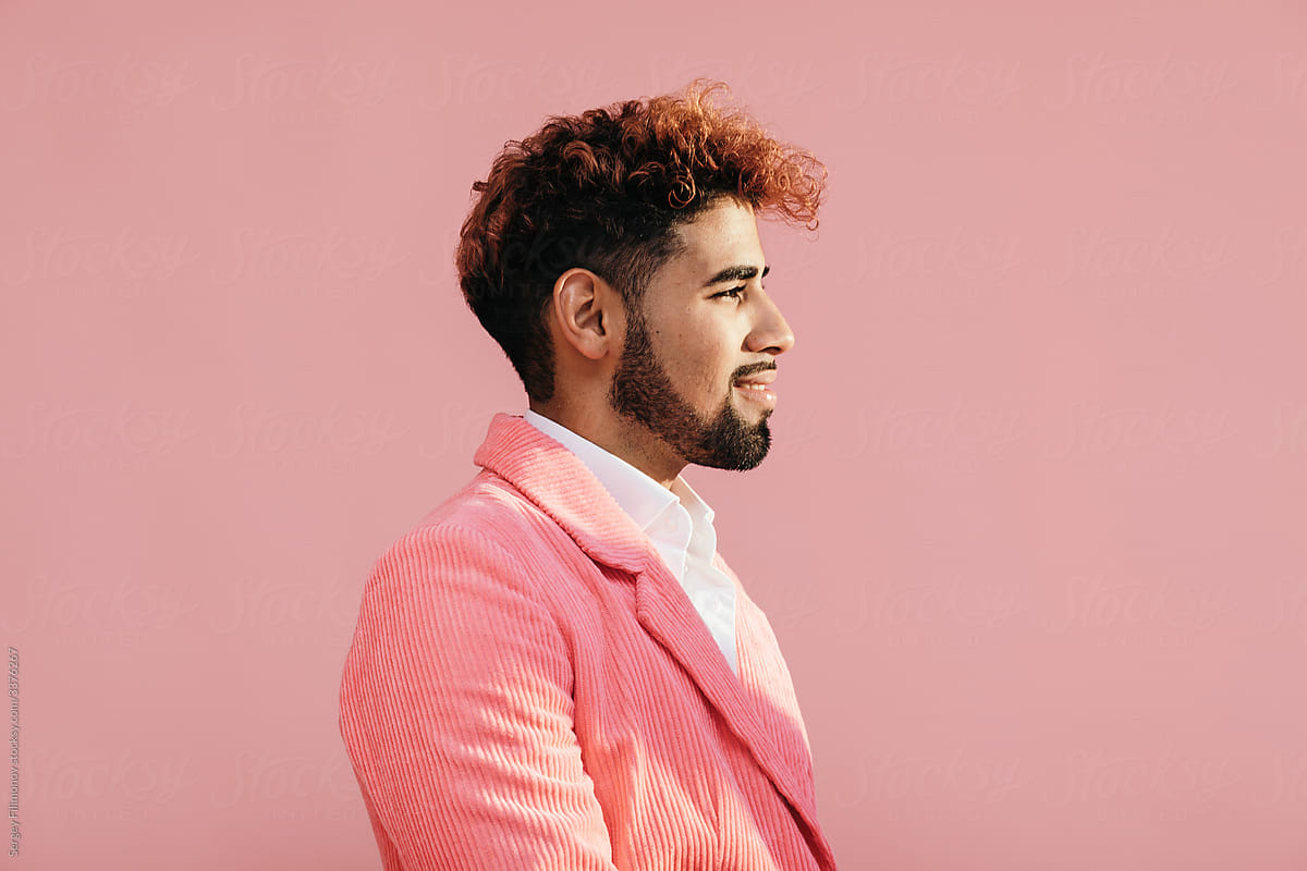 Handsome ethnic man in pink suit
