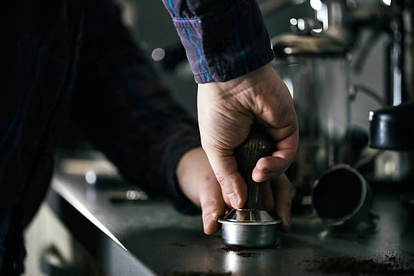 Old Fashioned Espresso Machine With Two Cups Of Coffee by Stocksy  Contributor Aleksandar Novoselski - Stocksy