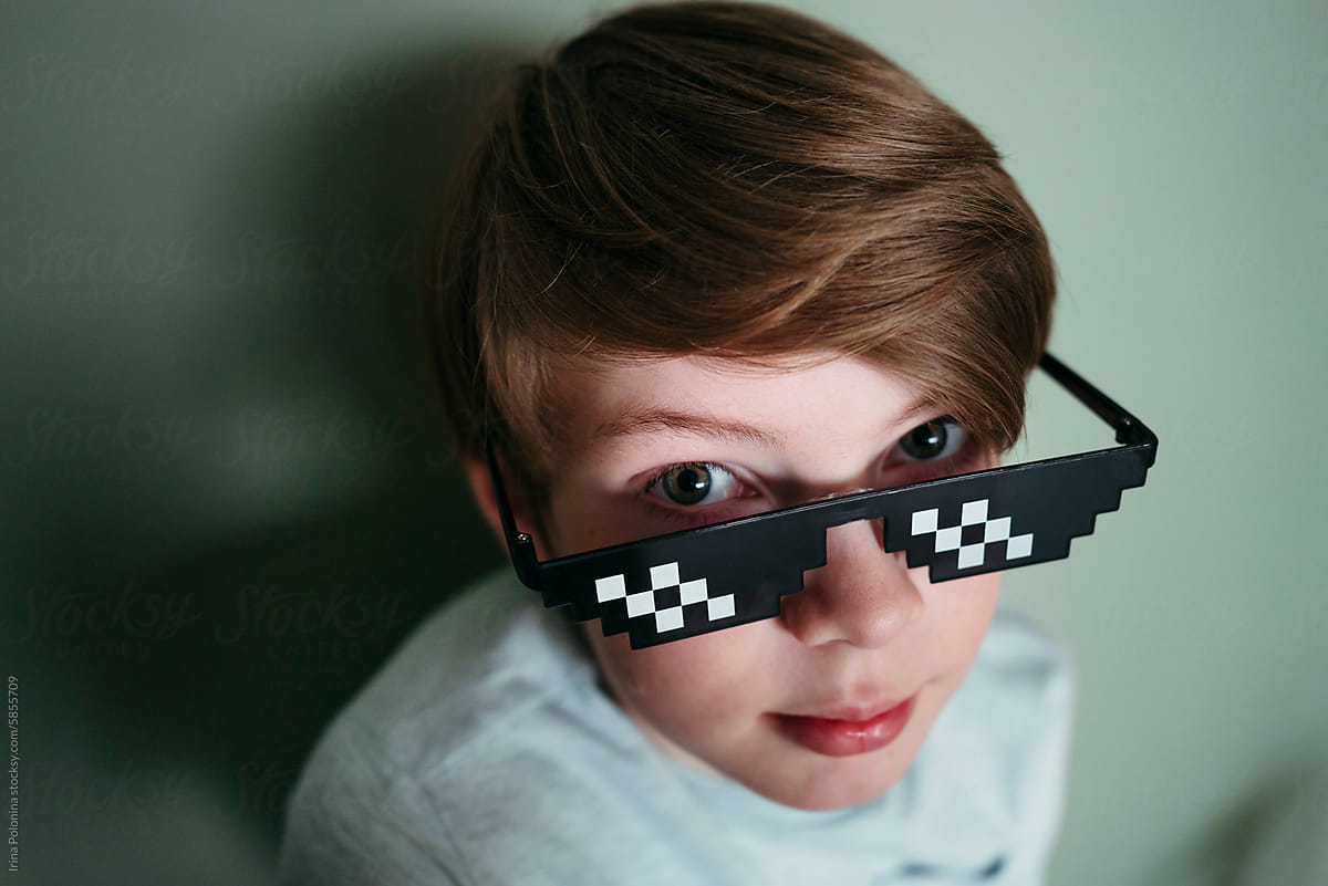 Funny boy in pixel sunglasses.