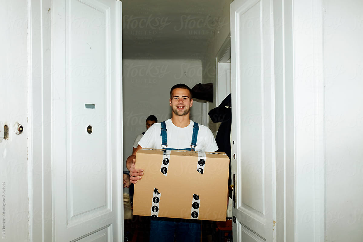 Worker carries a box