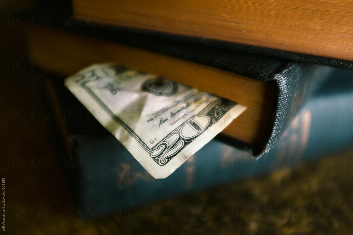 Personal Finanace: Twenty Dollar Bill in Book - Student Debt
