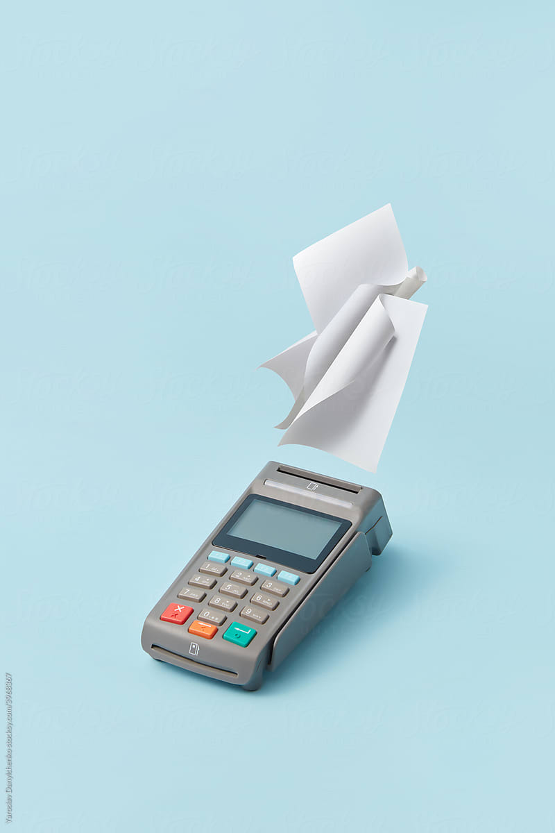 Terminal with blank receipts on light blue background