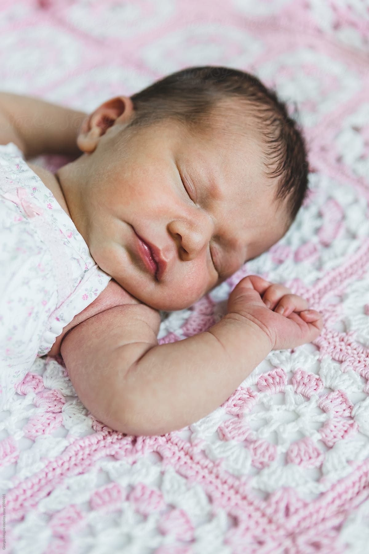 Newborn Baby Girl Sleeping on an Handmade Blanket