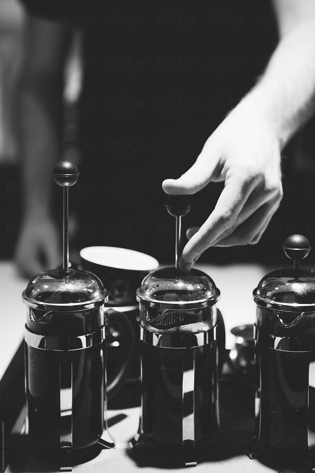 Close up of barista making French press coffee