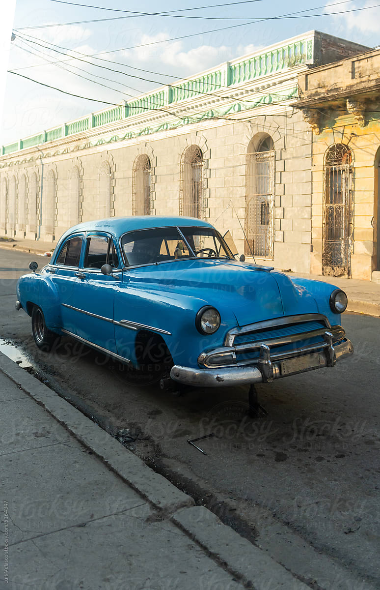 Old Blue Classic Car Stopped On Street In Cienfuegos City, Cuba.