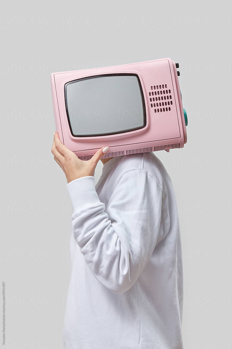 Retro pink TV in a place of woman's head.