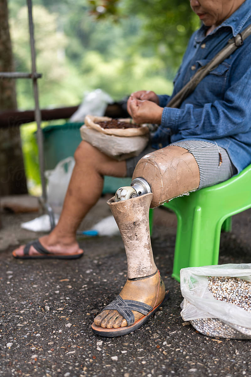 Craftswoman with a prosthetic leg.