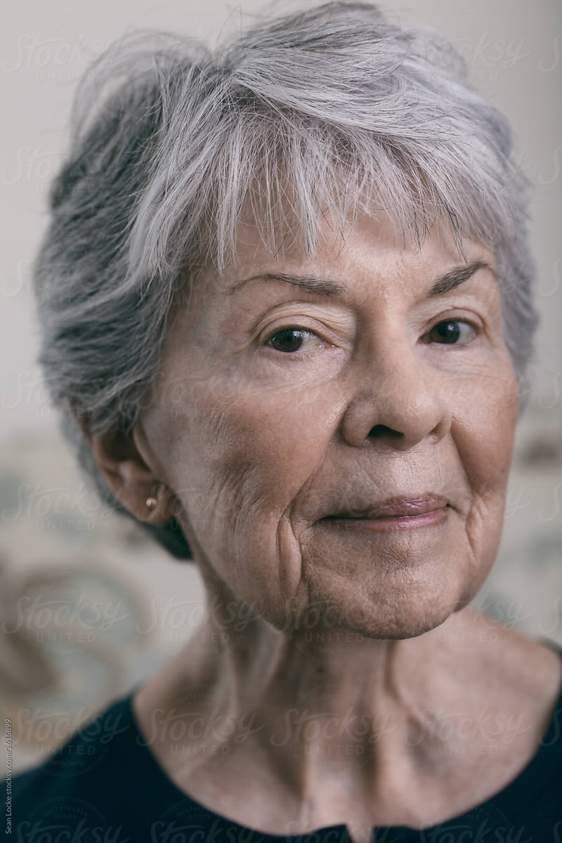 Senior: Silver Haired Woman Looking At Camera