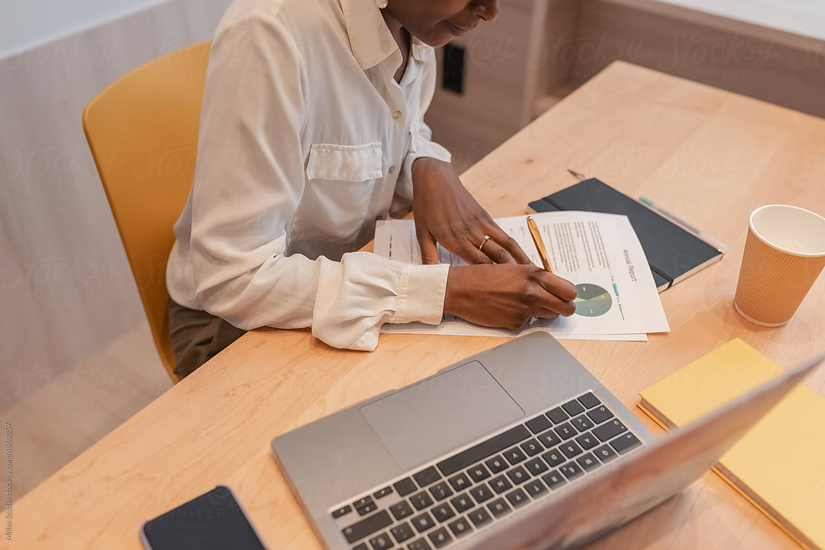 Black businesswoman making notes on paper