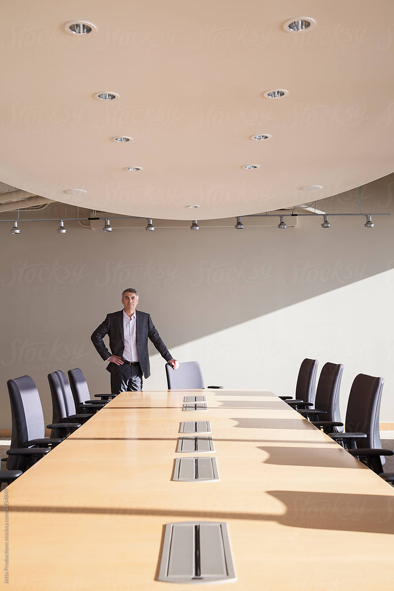 Male executive in conference room.