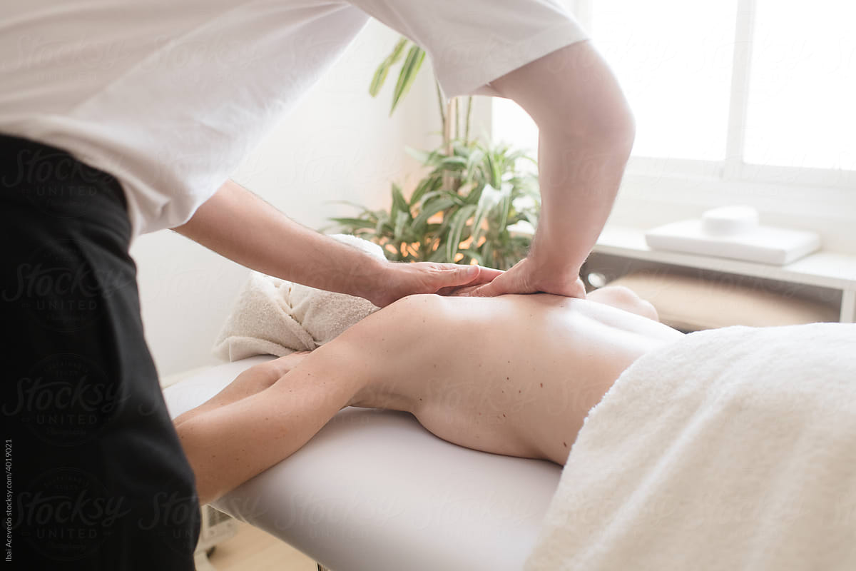 Osteopath doing a relaxing column massage