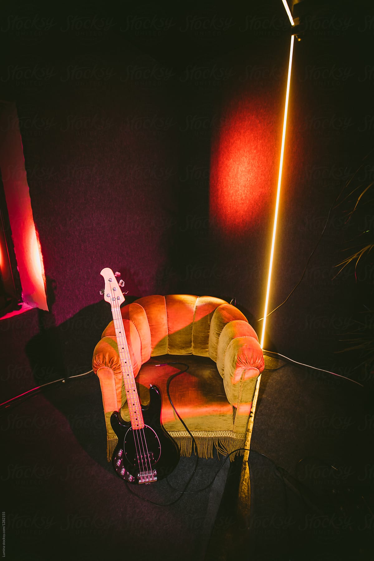 Electric Guitar On Velvet Armchair