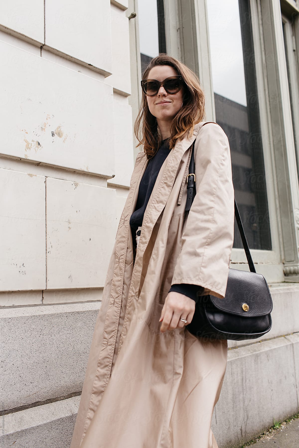 Elegant Woman Walking Down The Street by Stocksy Contributor