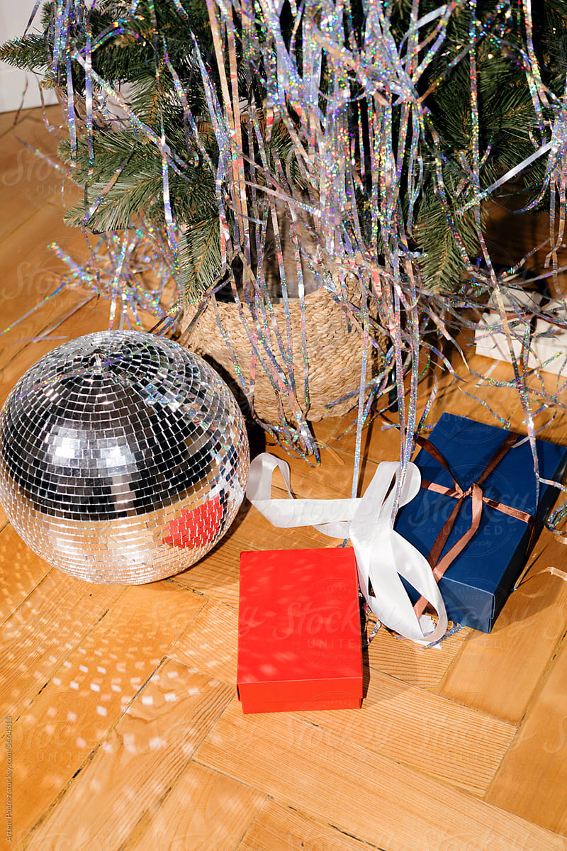 New Year\'s party mood, disco ball and gifts under the Christmas tree