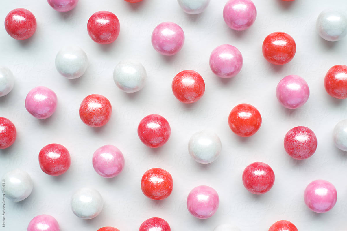 Overhead Shot Of Gum Balls Spread Out On A White Background by Stocksy  Contributor Melissa Ross - Stocksy