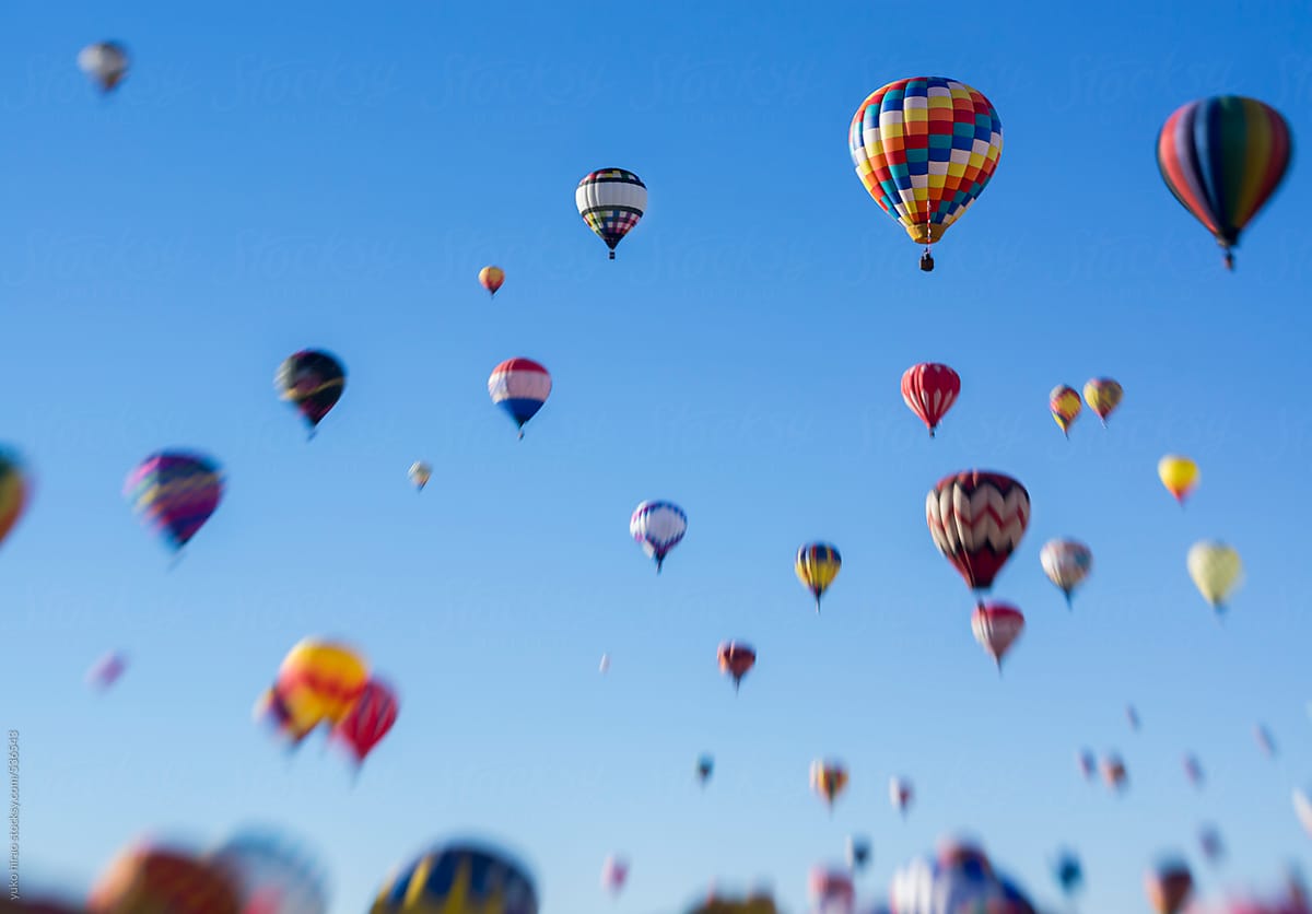 Hot air balloons assending into the blue sky