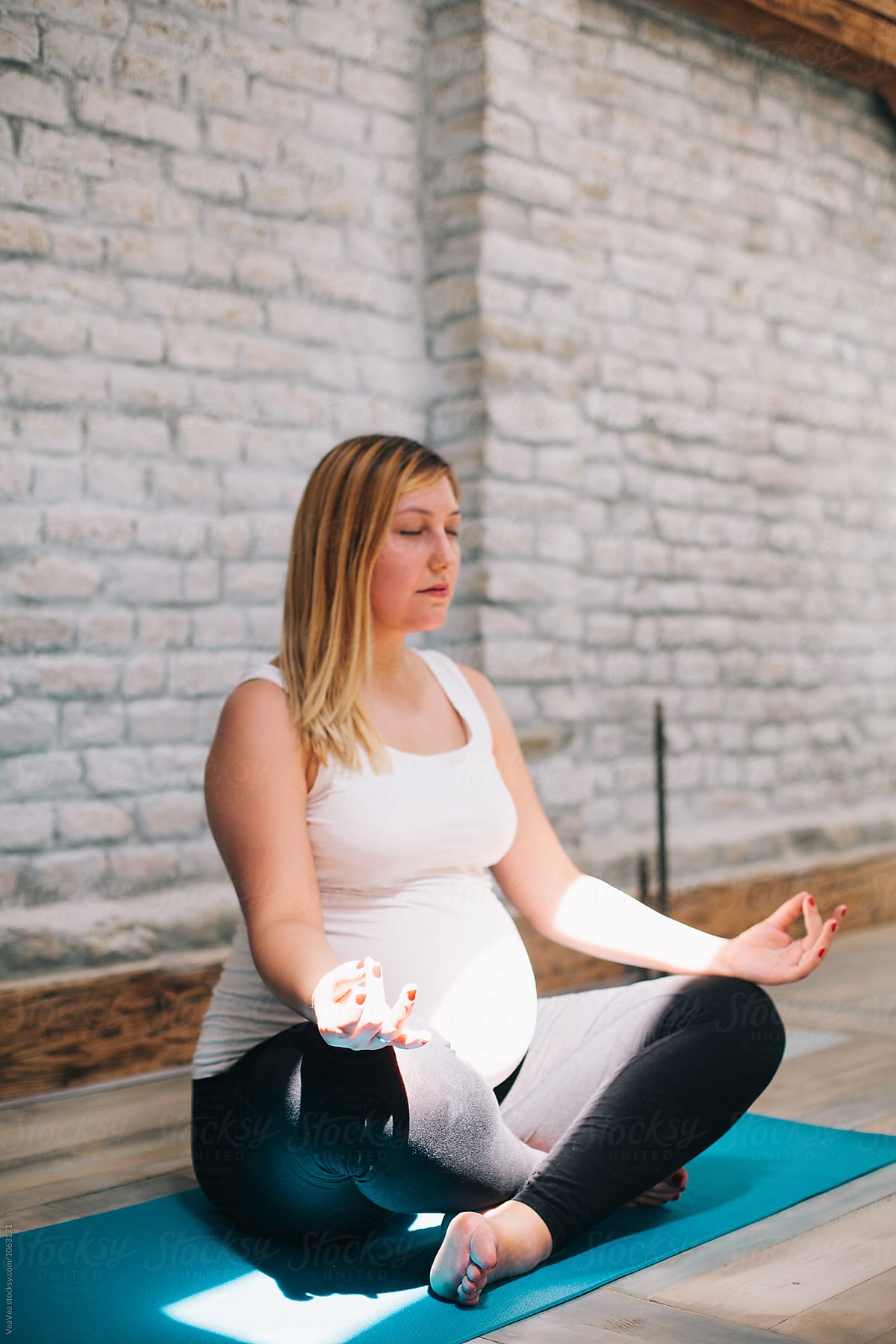 Woman meditating indoor