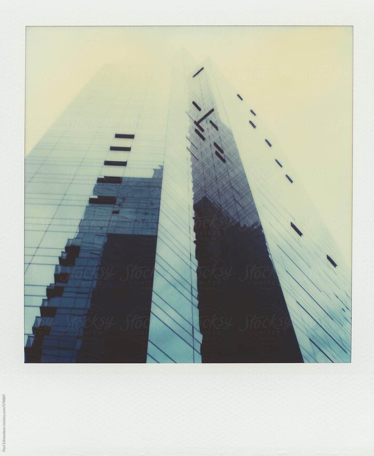 Modern office building extending towards sky (Polaroid SX-70 print)